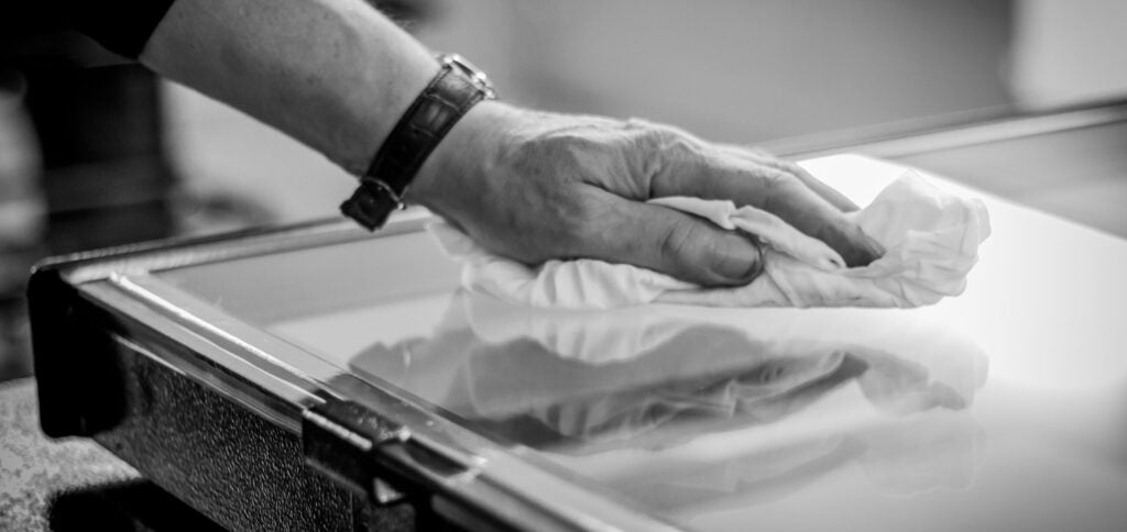 Man cleaning rooflight - Client Aftercare - Operations & Maintenance Manual - - Rooflight Aftercare